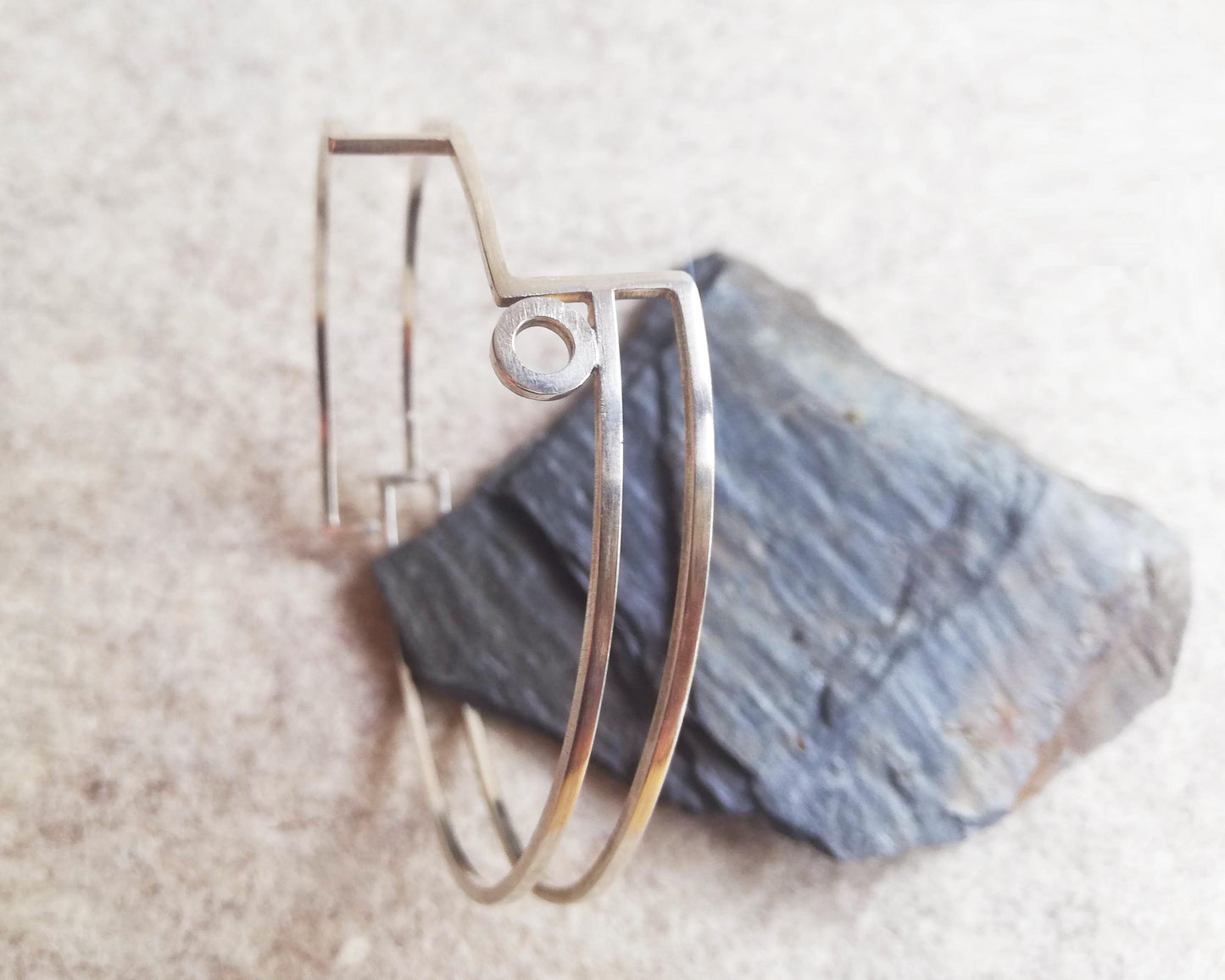 Silver linear stepped bangle with circle detail. Linear Bangle 2