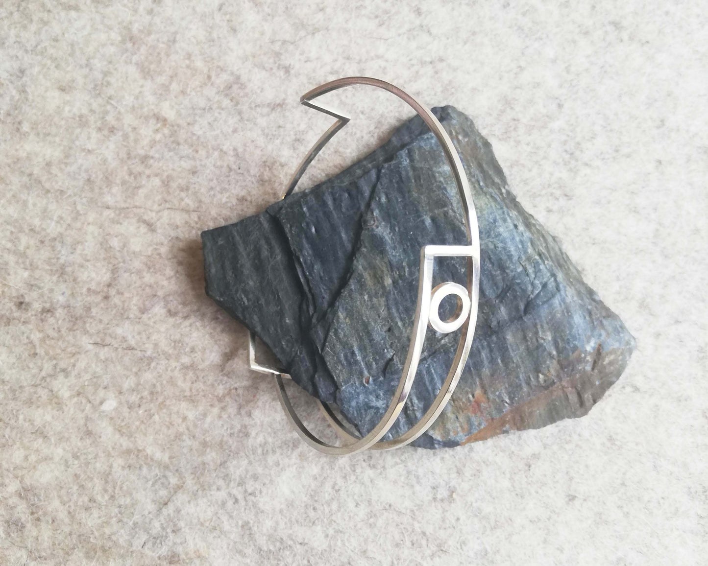 Silver linear bangle with circle detail by Inplico Design. Linear Bangle 2 handmade by Roz Adams