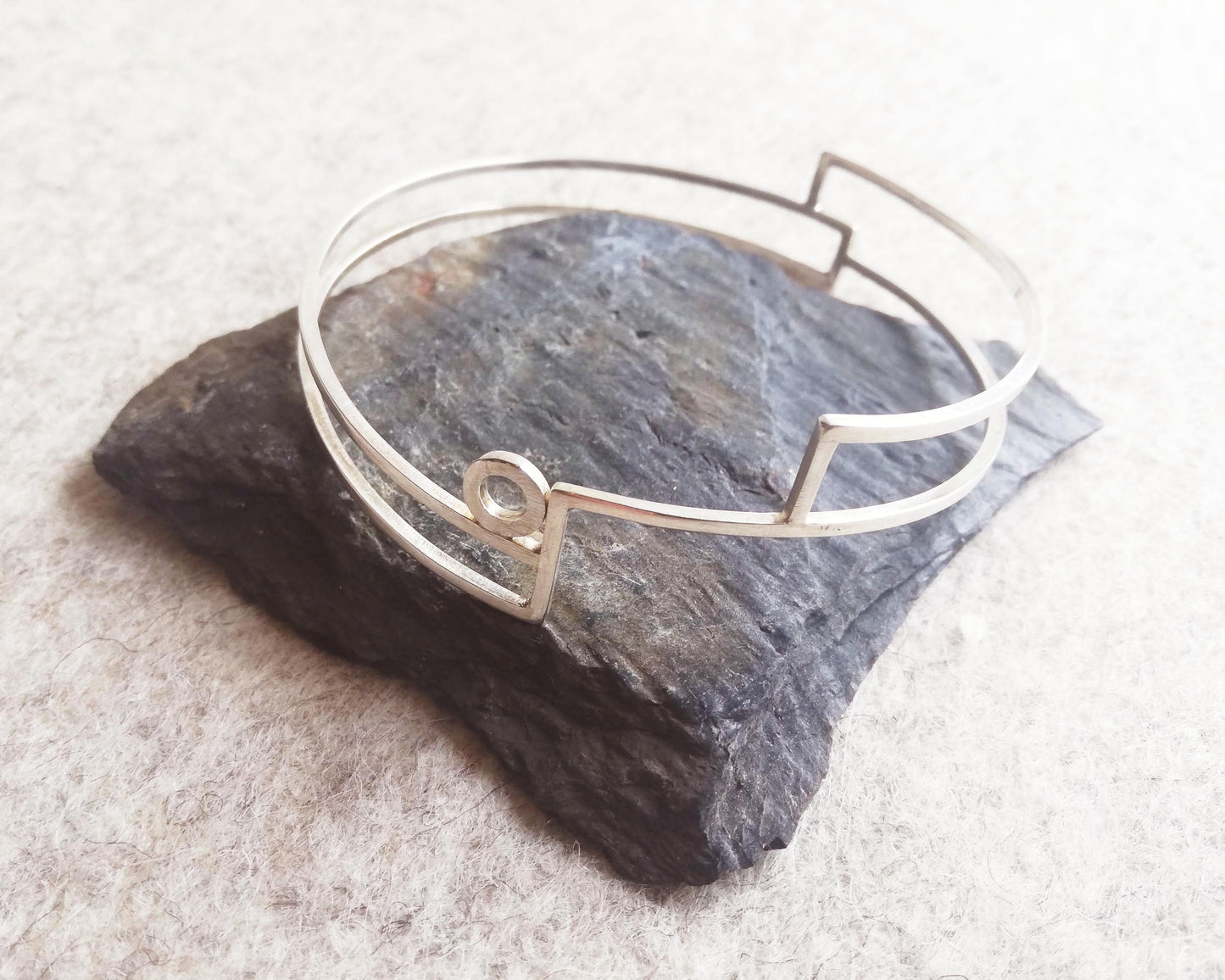 Silver linear stepped bangle with circle detail by Inplico Design. Linear Bangle 2 handmade by Roz Adams
