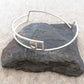Silver linear bangle with circle detail by Inplico Design. Linear Bangle 2 handmade by Roz