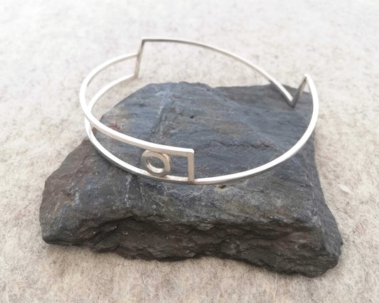 Silver linear bangle with circle detail by Inplico Design. Linear Bangle 2 handmade by Roz